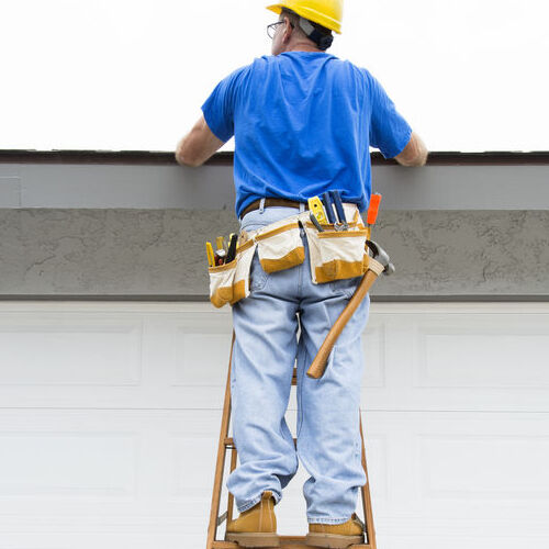 A Roofer Inspects a Roof