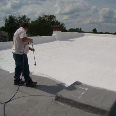 Commercial Roofer Applies Roof Coating.