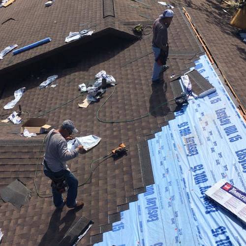 Roofers Install a Roof.